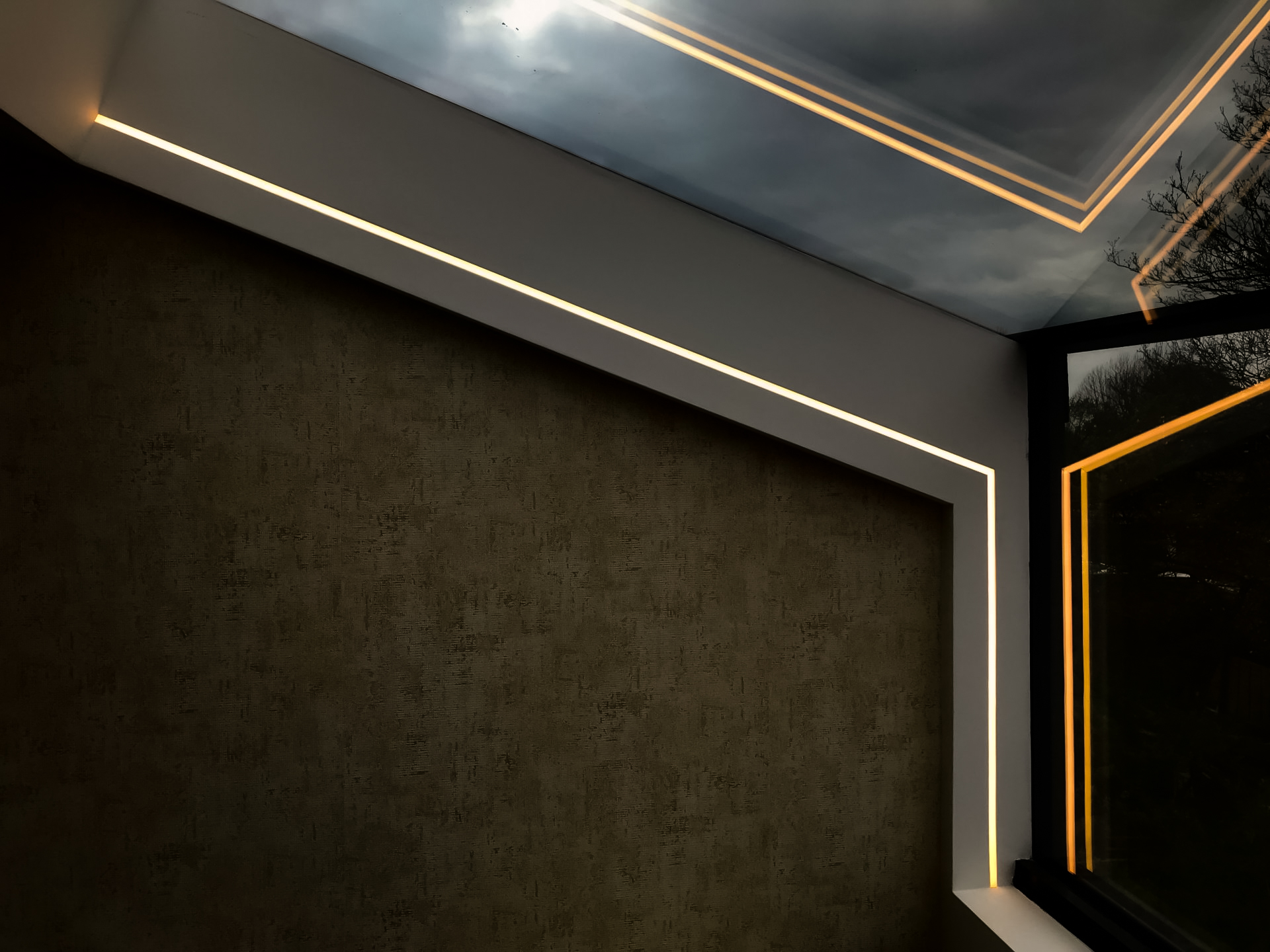 Dormer window with linear LED strip along the window frame