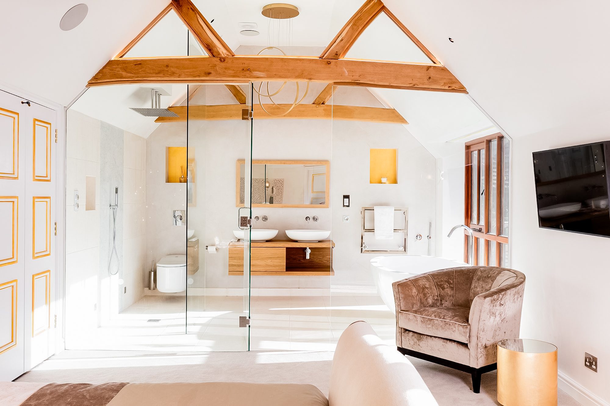 Modern designed bedroom and ensuite with extensive lighting design including recessed adjustable downlights