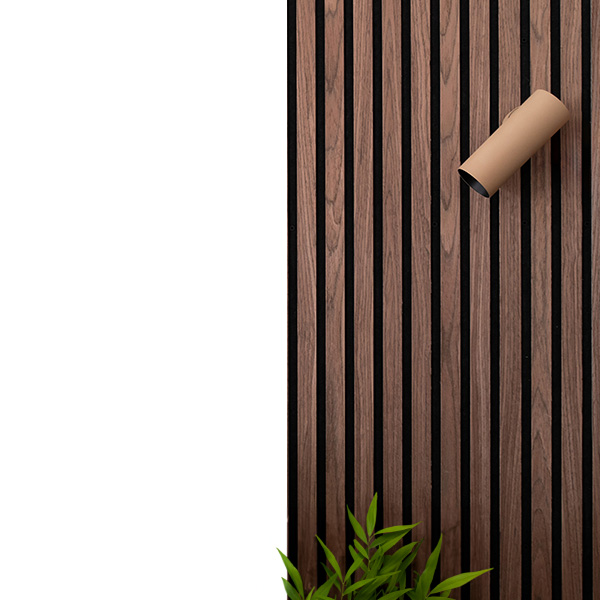 Fully adjustable spotlight mounted on panelled wall ceramic coated tan to blend in with wood panelling with green plant for decoration